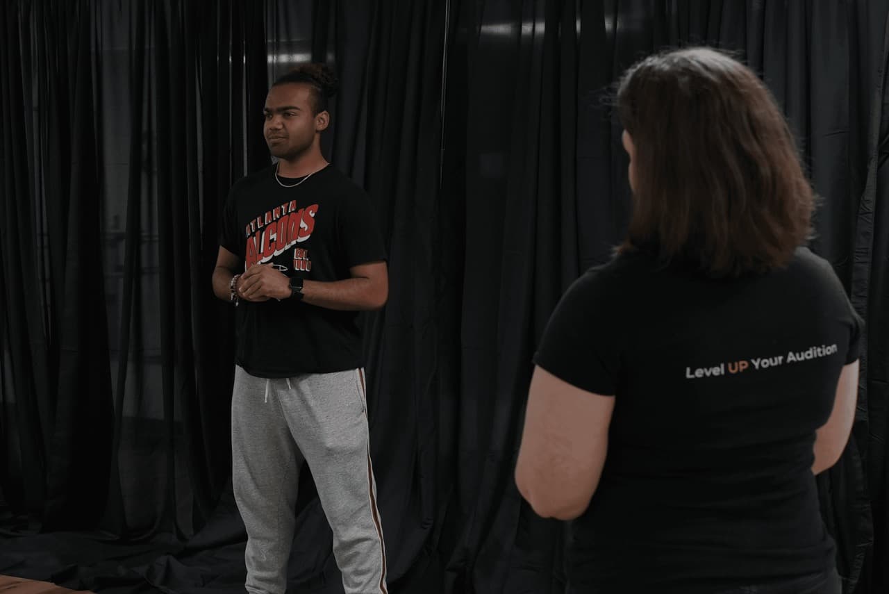 A University Prep coach working one-on-one with a student